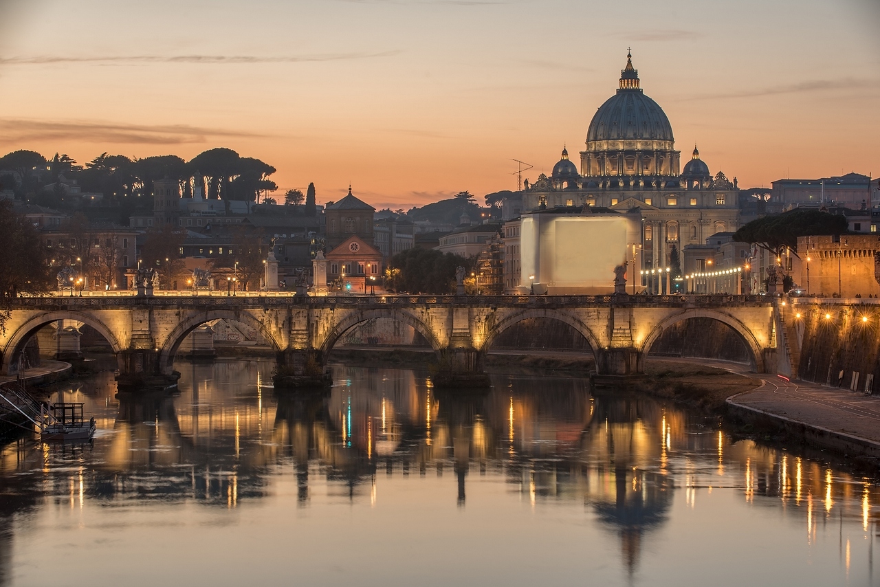 Rome, Italy: St. Peter's Basilica, Saint Angelo Bridge and Tiber River in the sunset